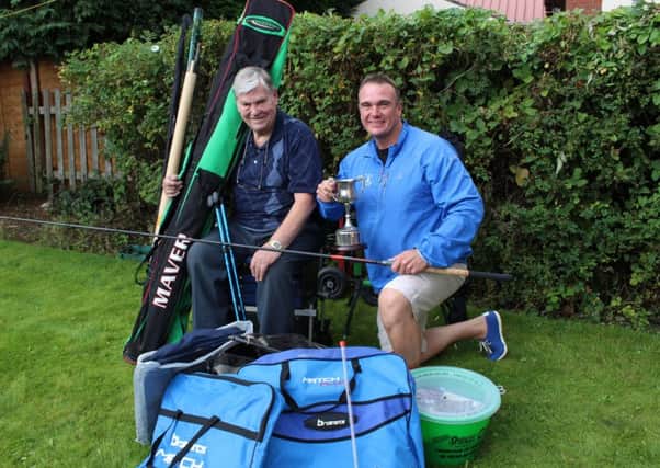 Former YEP columnist Dennis Lemmon with just a sample of the fishing tackle he donated to the juniors under the guidance of Yarnbury Angling Club coach Adie Addy.