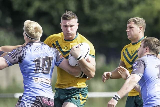 Hunslet Club Parkside's Ben Shulver is tackled.