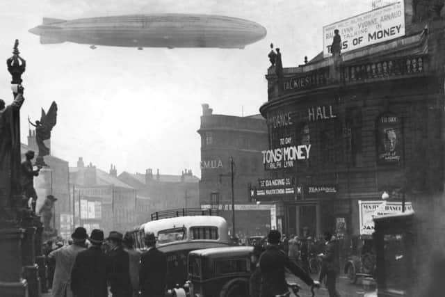 AUGUST 1931: The Graf Zeppelin over City Square.