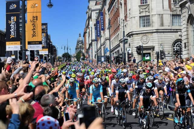 2014: Mark Cavendish leads the cyclists down the Headrow at the Start of the Tour de France. PIC: Simon Hulme