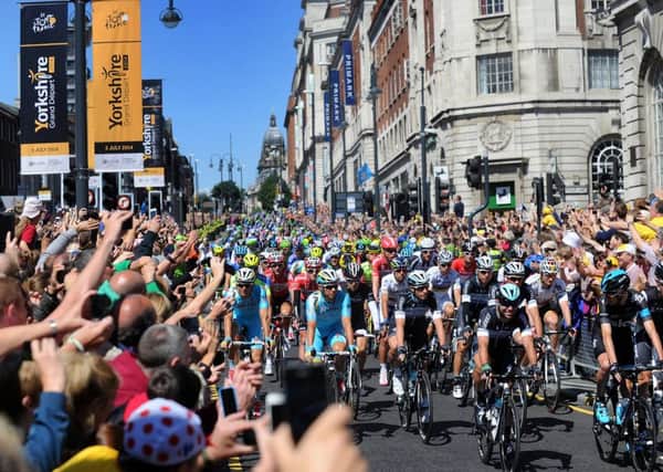 2014: Mark Cavendish leads the cyclists down the Headrow at the Start of the Tour de France. PIC: Simon Hulme