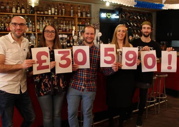 CHEERS!: North Bar staff have raised more than Â£30,000 for St Gemma's Hospice in Leeds.