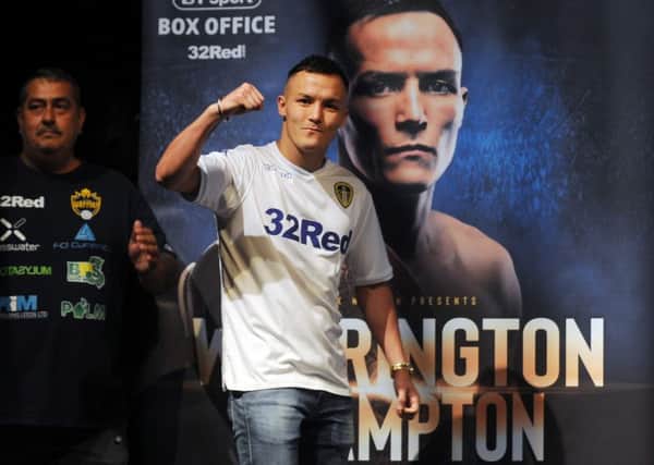 Josh Warrington salutes his fans during Wednesday's press conference for his world title fight against Carl Frampton. Picture: Simon Hulme