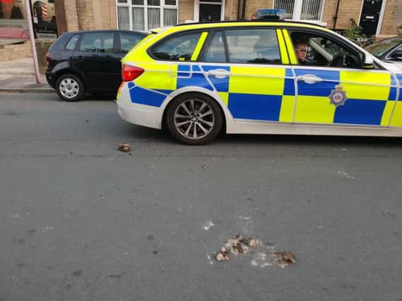 Photo: @Traffic_Dave. Police were reportedly 'bricked' in Bradford.