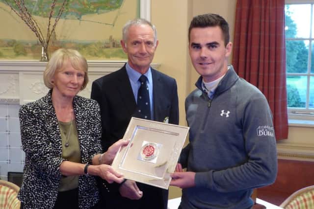 Malton & Norton's David Hague receives the North of England trophy after his win at Alwoodley last year.