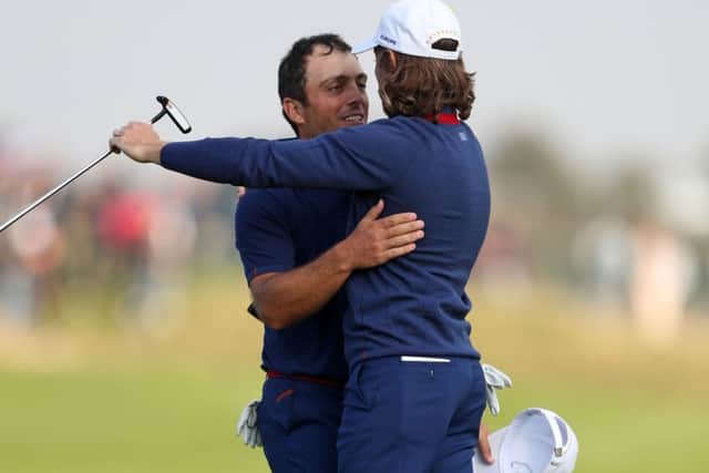 Open champion Francesco Molinari, left, and European No 1 Tommy Fleetwood embrace after completing victories in both their fourball and foursomes matches as Europe took a 5-3 first-day lead over the US in the Ryder Cup (Picture: David Davies/PA Wire).