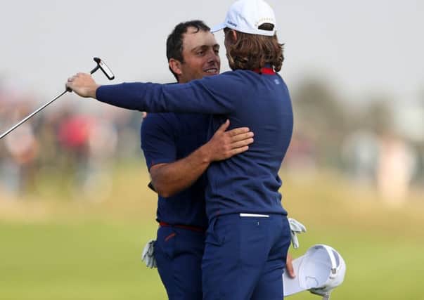 Open champion Francesco Molinari, left, and European No 1 Tommy Fleetwood embrace after completing victories in both their fourball and foursomes matches as Europe took a 5-3 first-day lead over the US in the Ryder Cup (Picture: David Davies/PA Wire).