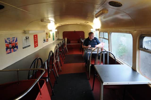 Photo Essay...The A64 Red Bus Cafe, on the A64, Leeds...A man has his breakfast on the top deck of the bus.SH1002021k..13th November 2014 Picture by Simon Hulme
