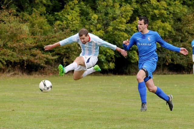 Zaine Laidlaw, of FC Armley Sundays, shoots against visitors The Woodcock AFC. PIC: Steve Riding