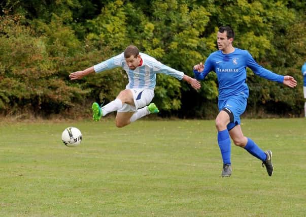 Zaine Laidlaw, of FC Armley Sundays, shoots against visitors The Woodcock AFC. PIC: Steve Riding