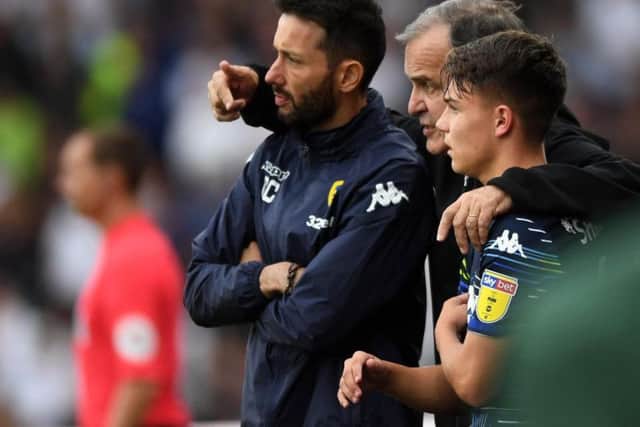 Marcelo Bielsa (middle) with Carlos Corberan (left) and Jamie Shackleton (right).
