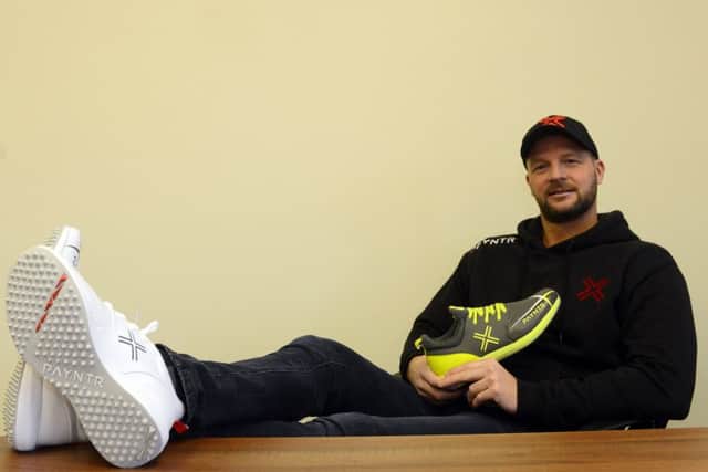 Feet up: David Paynter modeling a pair of Payntr's trainers. Picture Scott Merrylees