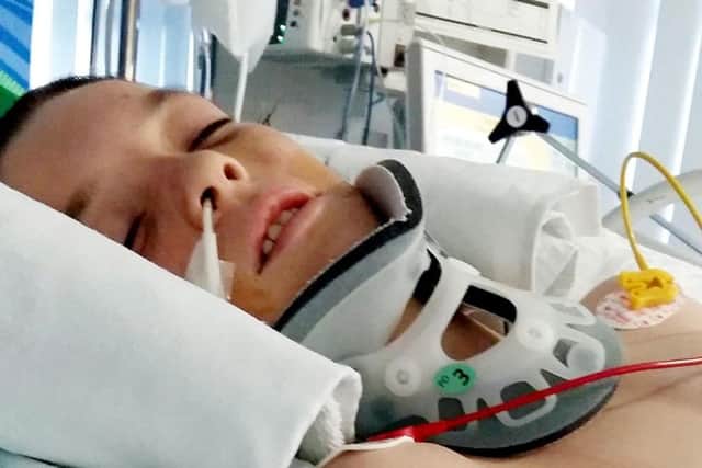 The mother of a young teenager who was knocked out at his school has told how his heart stopped twice after being floored by a single punch.