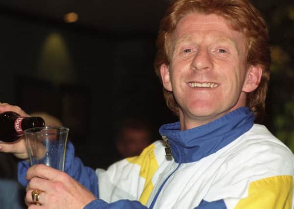 Gordon Strachan celebrating winning the First Division with a bottle of Bud.