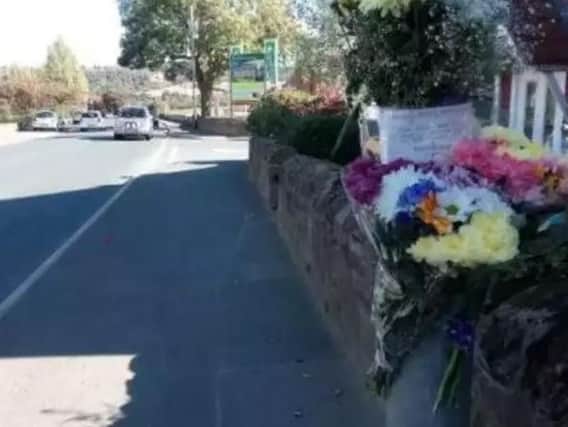 Floral tributes placed at the scene on Wide Lane at Morley