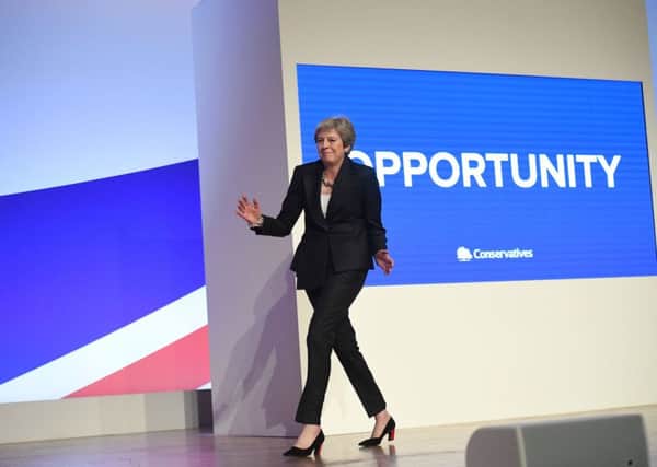 Prime Minister Theresa May dances as she arrives on stage to make her speech. Pic: Stefan Rousseau/PA Wire