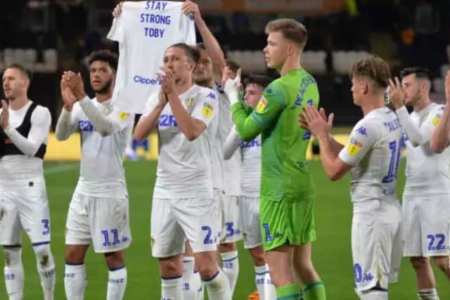 Leeds United players after Tuesday night's match  with the shirt urging Toby to 'stay strong'