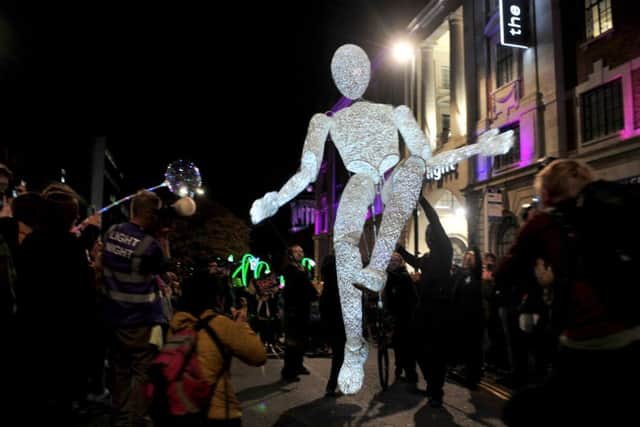 A giant illuminated puppet and a part of the Leeds Light Night parade on the festival's opening night in Leeds city centre.