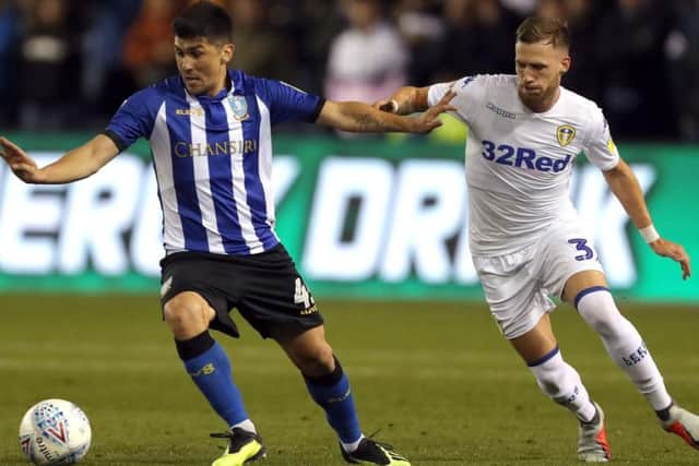 Leeds United left-back Barry Douglas (right) who will miss Saturday's game against Brentford at Elland Road through injury.