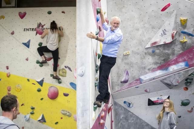 Jeremy Corbyn on a climbing wall at The Climbing Lab in Leeds