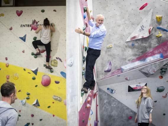 Jeremy Corbyn on a climbing wall at The Climbing Lab in Leeds