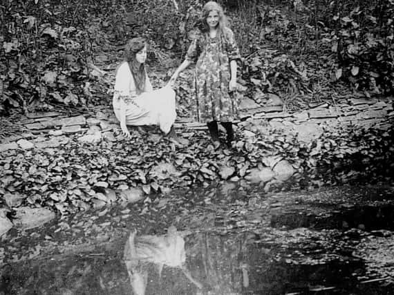 Elsie Wright (left) and Frances Griffiths (right), the two girls responsible for The Cottingley Fairies photographic hoax.