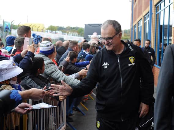 Leeds United head coach Marcelo Bielsa greets fans as he arrives at Elland Road for today's Championship game against Brentford.