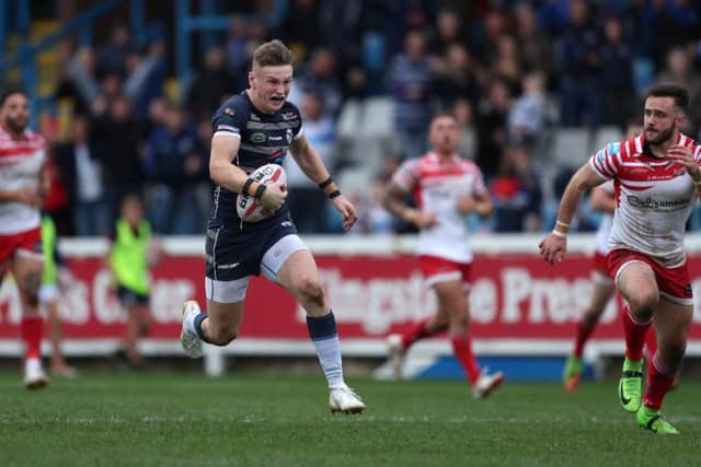 Featherstone's Harry Newman on his way to scoring a try