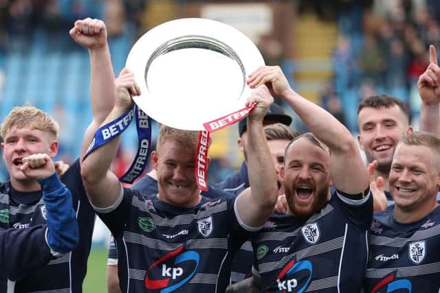 Featherstone celebrate with the Shield