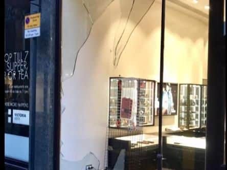 The smashed window at the Diesel store. PIC: Shaun Wade