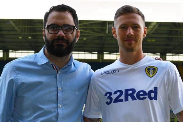 Leeds United director of football Victor Orta (left) with summer signing Barry Douglas (left).