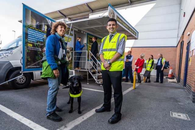 Date:9th October 2018.
Picture James Hardisty.
First Bus Leeds, at their Goodman Street, Leeds, depot had a visit by the Guide Dogs sensory unit which aims to give people with normal vision the perspective of what itÃ¢Â¬"s like to be blind or partially sighted. As drivers walk through wearing a mask they will experience different noises, textures and obstacles, in a  pitch black tunnel which will alter the senses used in everyday life.  Pictured Nikki Allen, with her guide dog Rita, chatting to Richard Tandy, Operations Manager at First Bus Leeds, as staff members line up to take part in the experience.