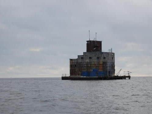 The structure is described as a detached house and has a guide price of 100,000.