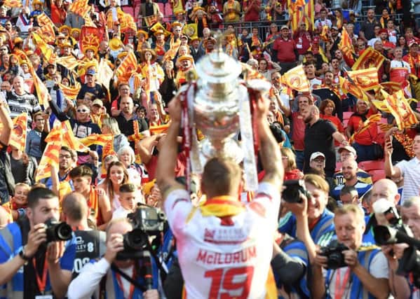 Catalans Dragons lift the Challenge Cup.