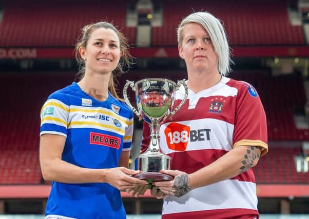 Leeds Rhinos' Courtney Hill and Wigan's Gemma Walsh with the Women's  Super League Trophy. Picture: Allan McKenzie/SWpix.com.