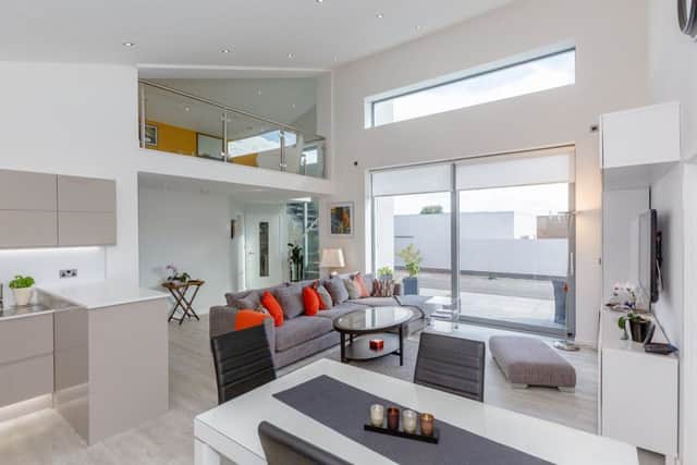 The open plan living space with mezzanine above