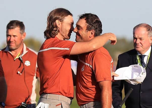 'MOLIWOOD': Francesco Molinari and Tommy Fleetwood, left, celebrate victory on day two of the Ryder Cup in Paris. Picture: Gareth Fuller/PA