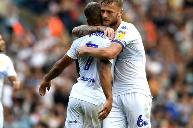 Kemar Roofe, pictured with Leeds United captain Liam Cooper, is targeting a comeback against Blackburn Rovers on October 20.