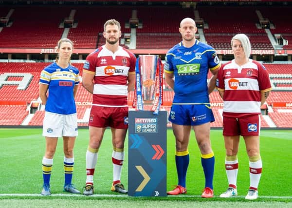 Leeds' Courtney Hill with Wigan's Sean O'Loughlin, Warrington's Chris Hill and Wigan's Gemma Walsh with the Betfred Super League Trophy.