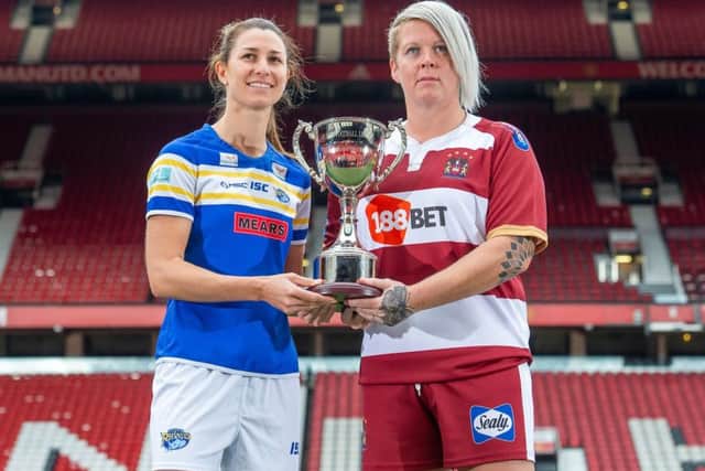 Leeds' Courtney Hill and Wigan's Gemma Walsh with the Womans Rugby Football League Super League Trophy.