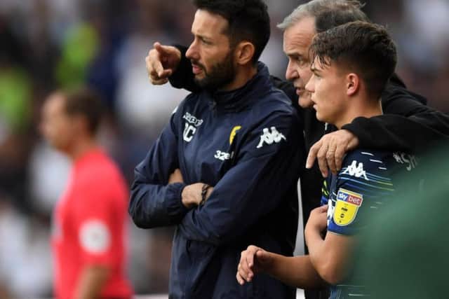 Leeds United head coach Marcelo Bielsa with assistant Carlos Corberan and academy-produced midfielder Jamie Shackleton.