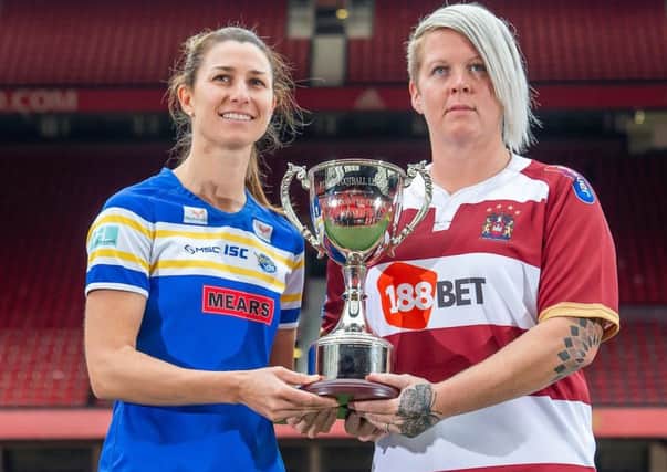 Final foes: Leeds' Courtney Hill and Wigan's Gemma Walsh with the Women's  Super League Trophy.