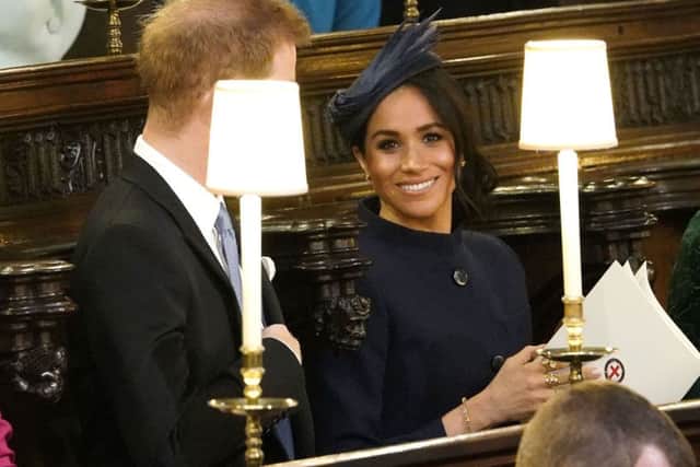 The Duke and Duchess of Sussex take their seats. PIC: PA