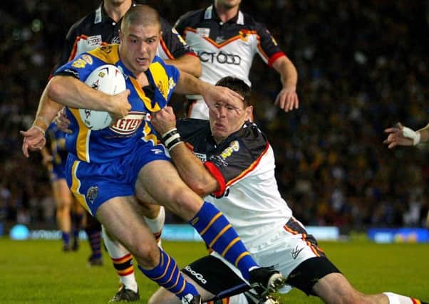 Leeds Rhinos' Matt Diskin bulldozes his way past Bradford Bulls' Michael Withers to score his team's opening try during the Super League Grand Final in 2004.