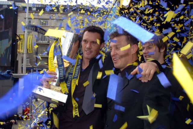 Departing players Matt Adamson and Dave Furner say their farewells to the Rhinos fans after the 2004 Grand Final.