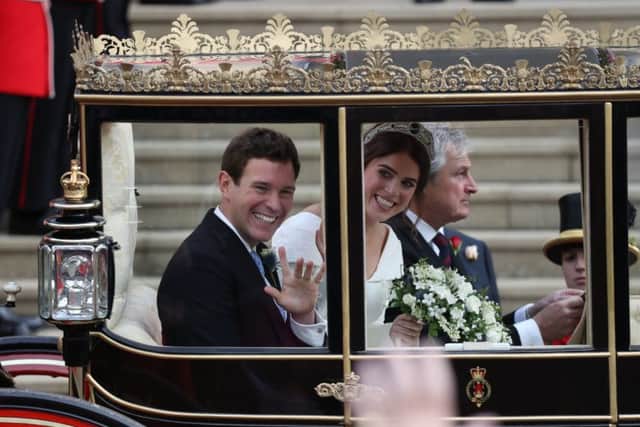 Princess Eugenie and her new husband Jack Brooksbank leave St George's Chapel in Windsor Castle. PIC: PA