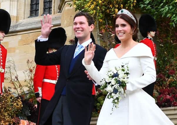 Princess Eugenie and her new husband Jack Brooksbank leave St George's Chapel in Windsor Castle following their wedding. PIC: PA
