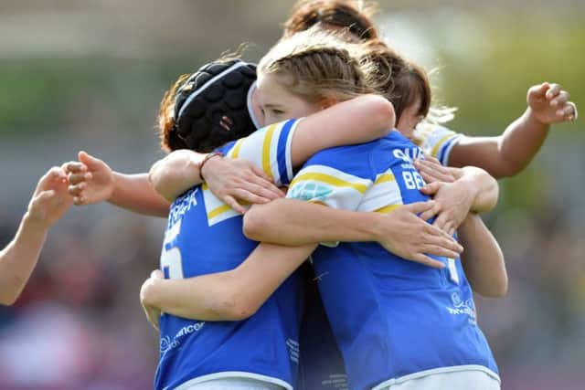 Caitlin Beevers celebrates after scoring Leeds Rhinos third try against Wigan.