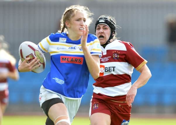 Caitlin Beevers runs through for the Leeds Rhinos' second try against Wigan Warriors.