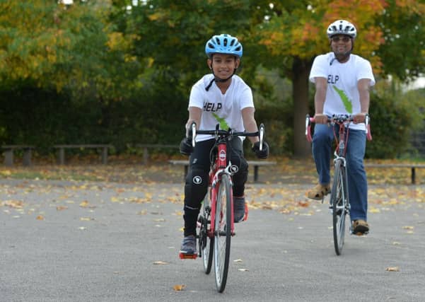 9 year old Daniel Kunnel and his father Anthony Augustine are doing a marathon bike ride to raise funds for those affected by flooding in Kerala in India. Inspired by his determination, Daniel's teacher, Richard McCarthy (left) is to join them for part of the journey.
11 October 2018. Picture Bruce Rollinson